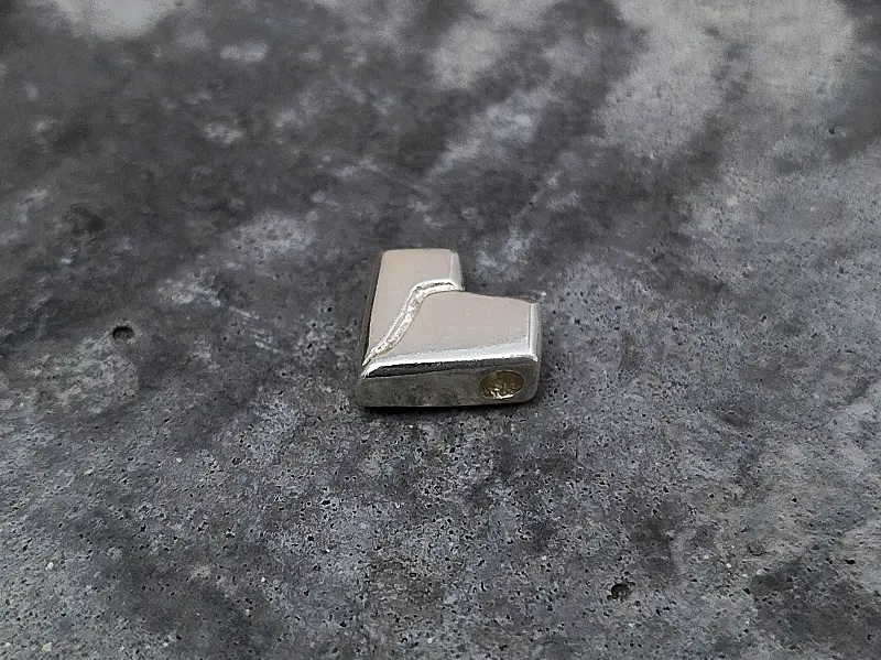 sandcast silver broken heart medal
